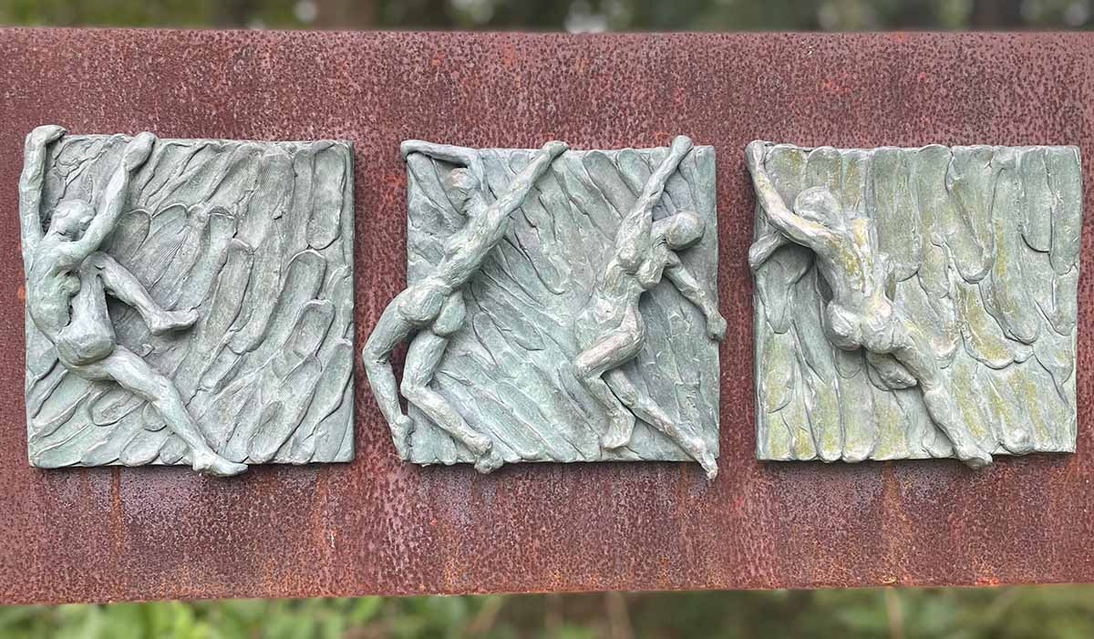 A sculpture depicting people wild swimming by Keziah Burt